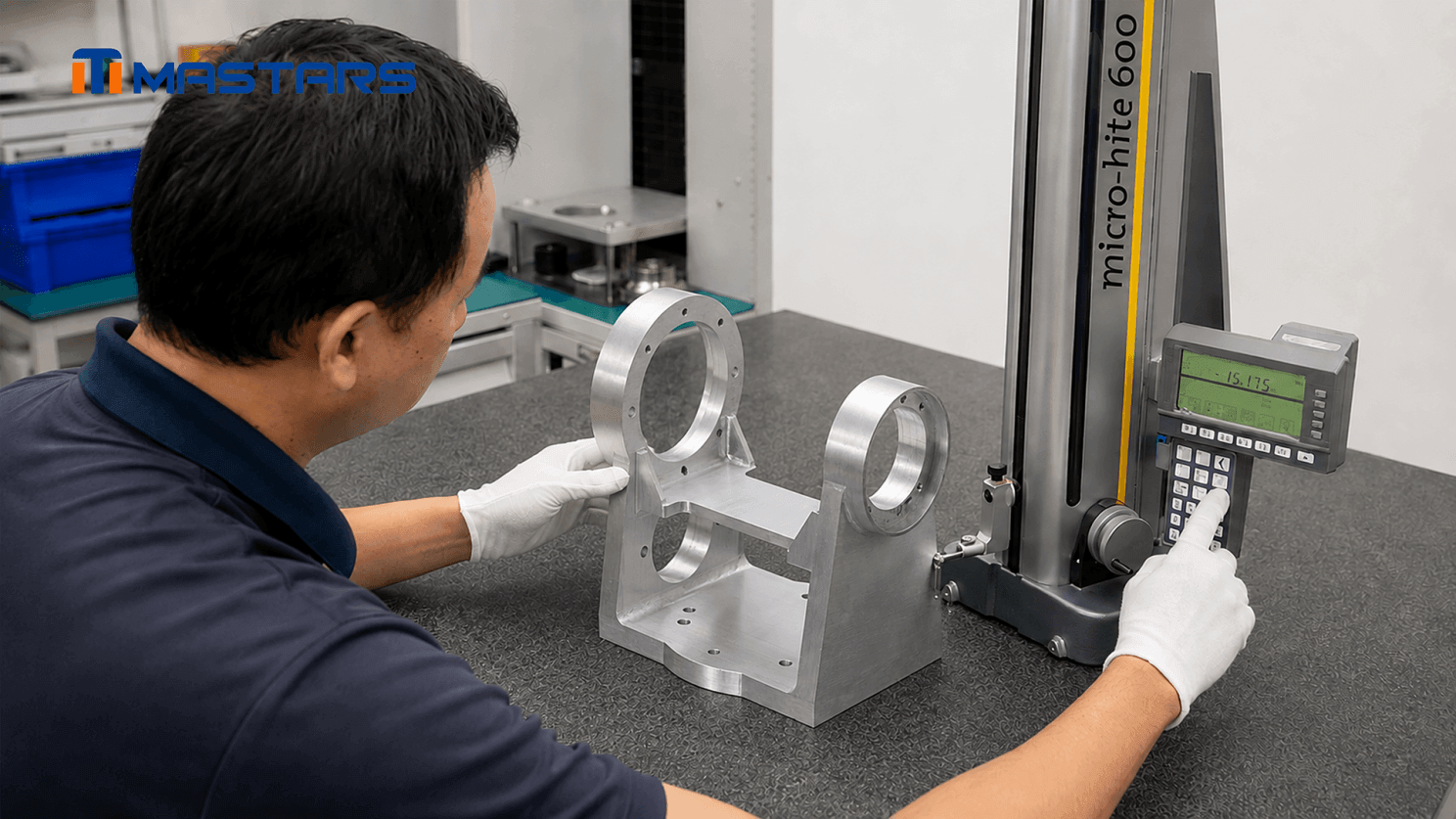 A Mastars engineer performs dimensional inspection on a CNC-machined aluminum bracket with reinforcing ribs