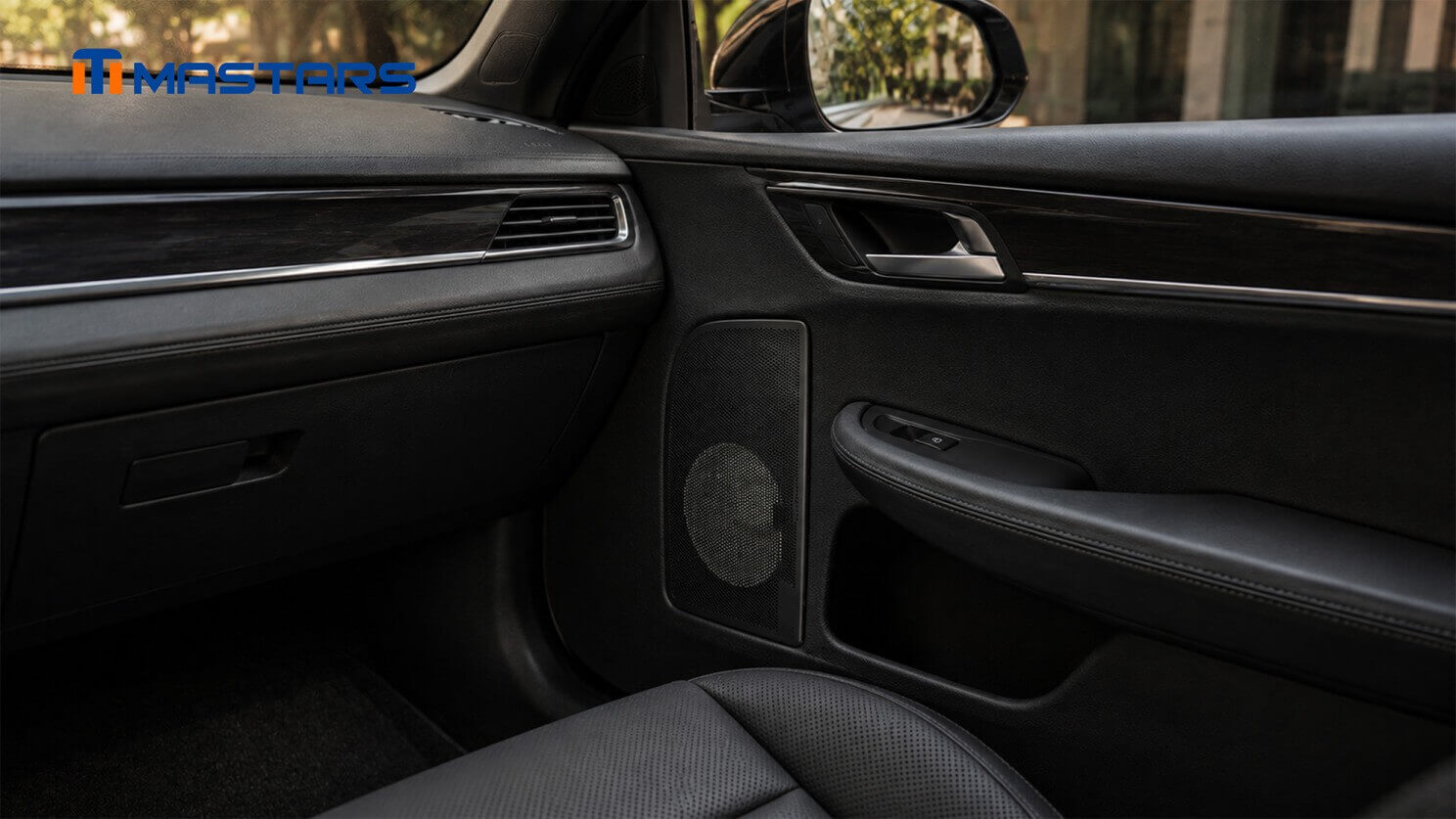Speaker grille shown in its intended automotive interior application