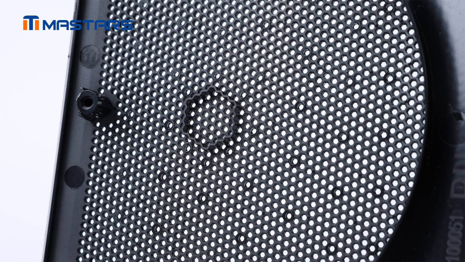Detailed grille structure reveals dense perforations and mounting features