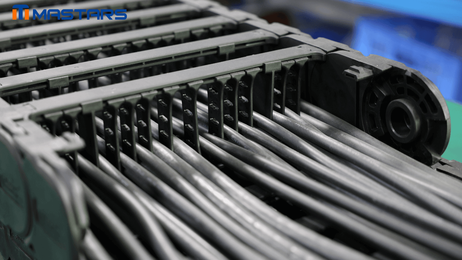 Internal cable separation and guidance structure for organized cable movement during repeated travel. Internal cable separation and guidance structure for organized cable movement during repeated travel.