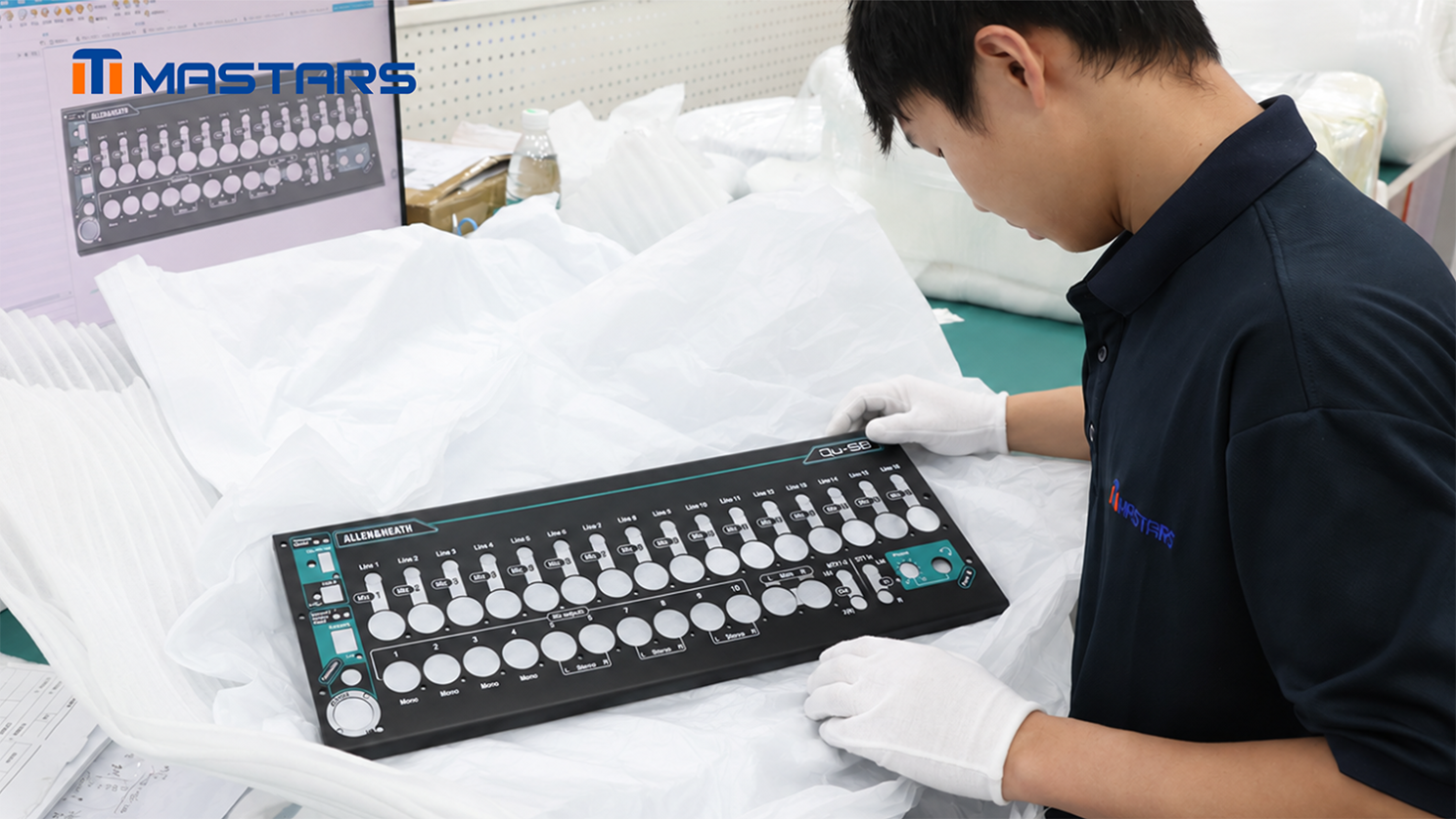 A Mastars engineer checks the enclosure prototype against the CAD model, reviewing its structure, openings, bends, and printed layout. A Mastars engineer checks the enclosure prototype against the CAD model, reviewing its structure, openings, bends, and printed layout.