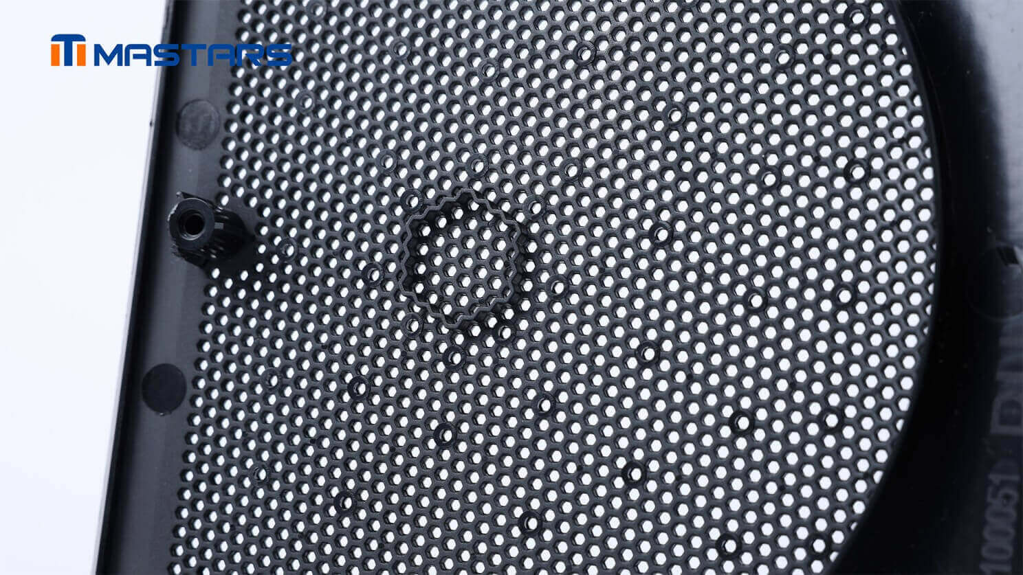 Detailed grille structure reveals dense perforations and mounting features