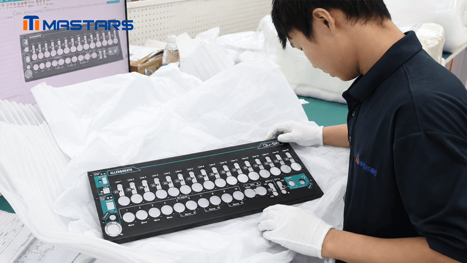 A Mastars engineer checks the enclosure prototype against the CAD model, reviewing its structure, openings, bends, and printed layout. A Mastars engineer checks the enclosure prototype against the CAD model, reviewing its structure, openings, bends, and printed layout.