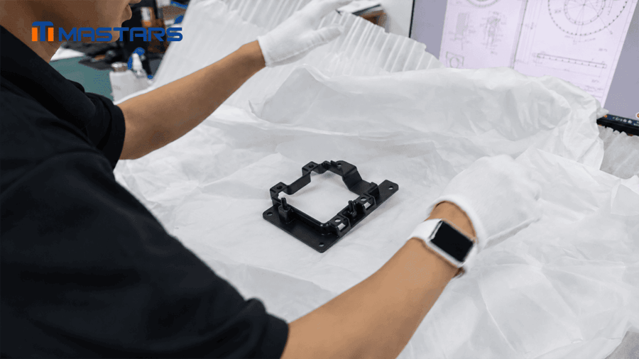 Mastars team inspects the camera mounting bracket and its critical assembly features.