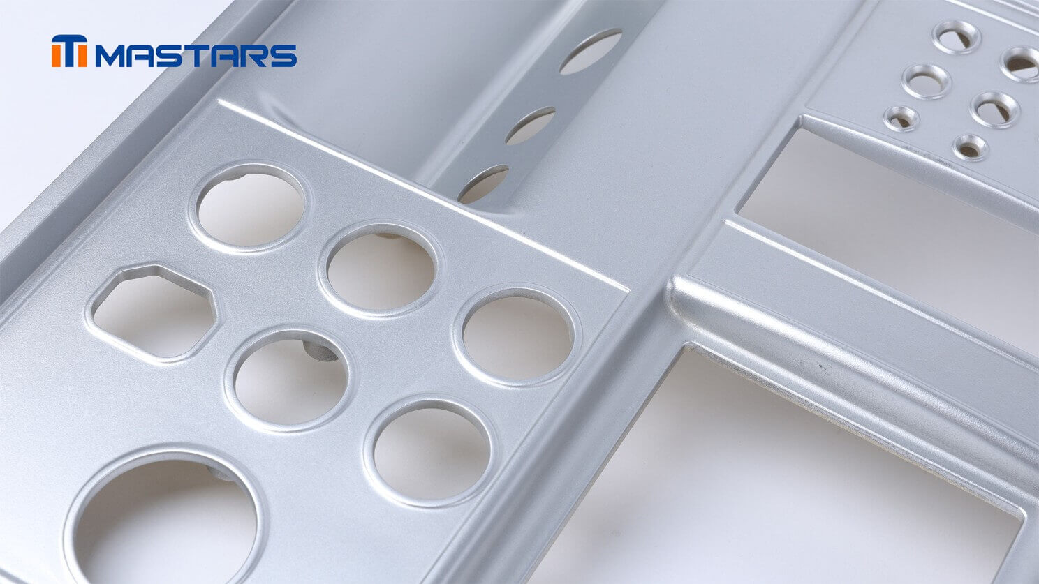 Close-up of pearl chrome finishing across precision openings, curved transitions, and recessed surfaces.