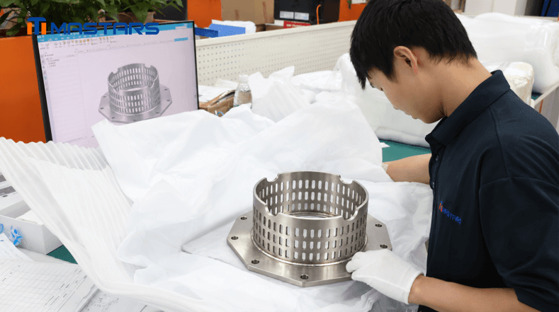 A Mastars engineer inspects the stainless steel assembly, checking its structural details and overall manufacturing quality. A Mastars engineer inspects the stainless steel assembly, checking its structural details and overall manufacturing quality.